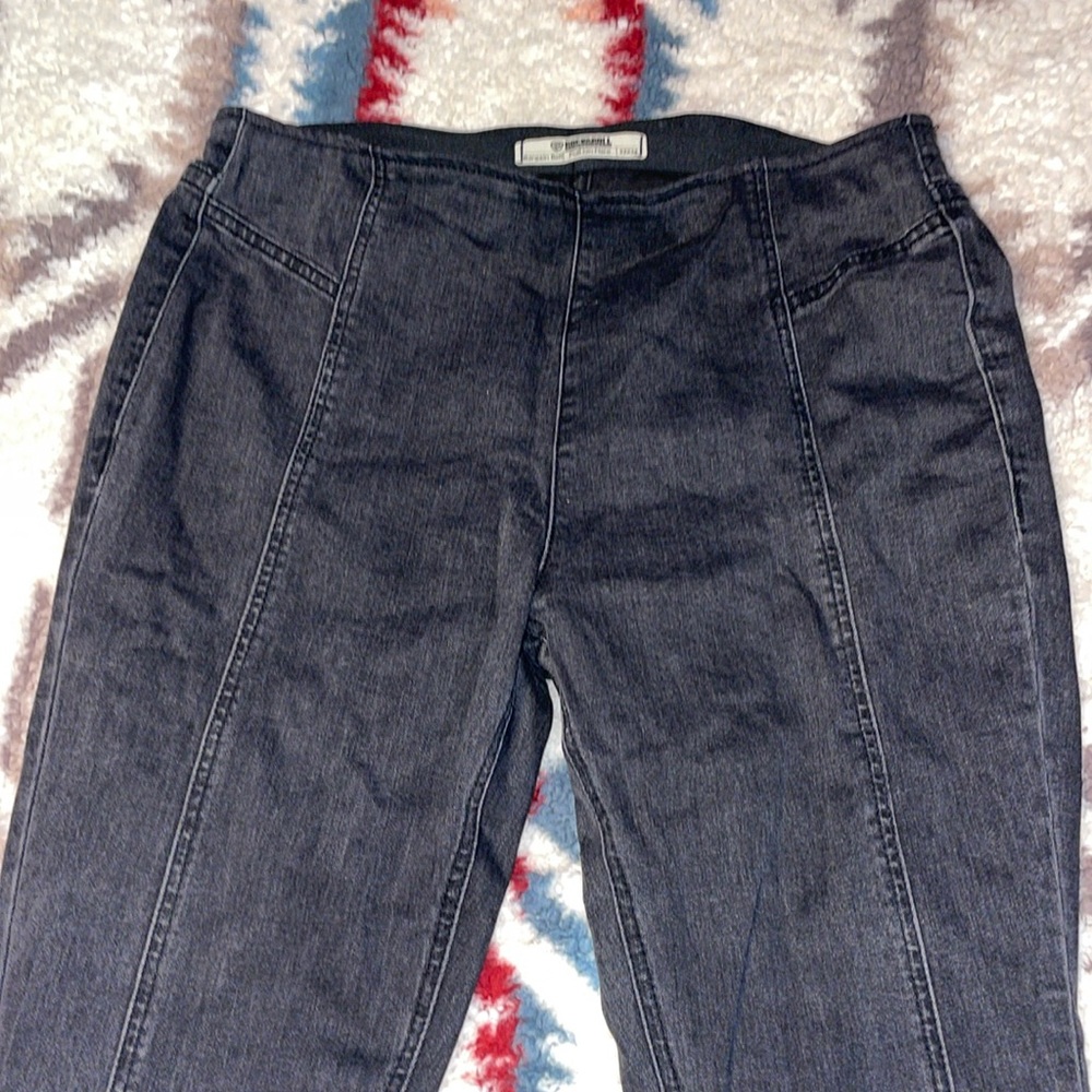 Women’s black bell bottom jeans, stretchy I would say they could fit a size 30!